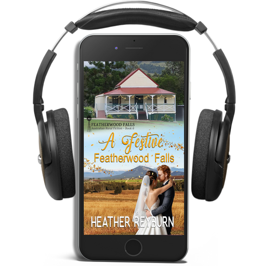 Phone displaying a book cover of 'A Festive Featherwood Falls' by Heather Reyburn with headphones on a white background