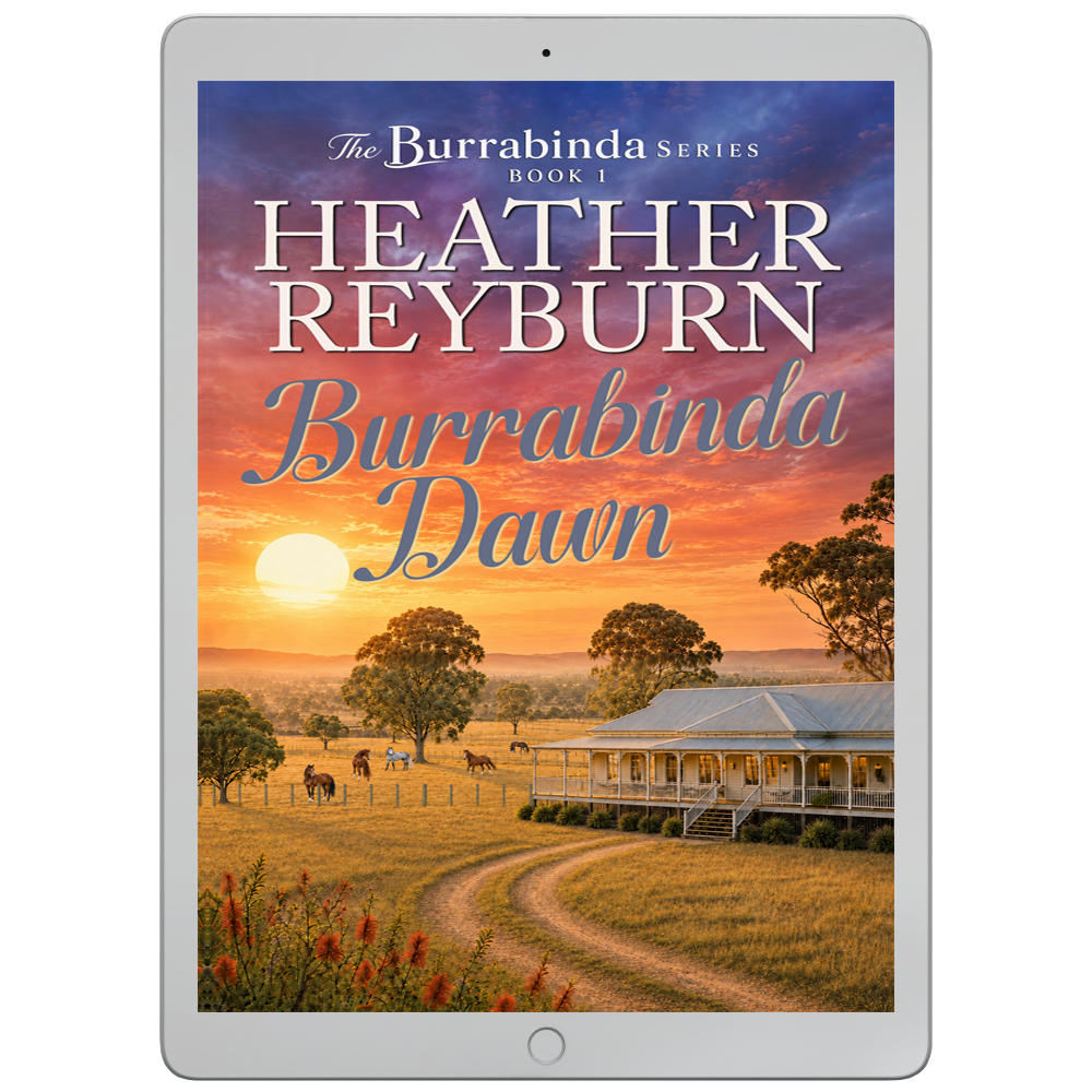 A tablet device displaying the book cover for 'Burrabinda Dawn' by Heather Reyburn, showing a sunset farm scene with a house, trees, and horses. The tablet is centered on a plain white background.